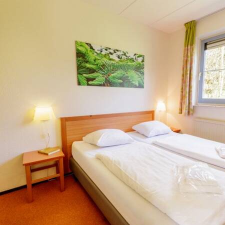 Een slaapkamer in een accommodatie op Center Parcs Park Eifel