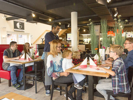 Genieten van een diner in restaurant Gusto op vakantiepark Landal Dwergter Sand