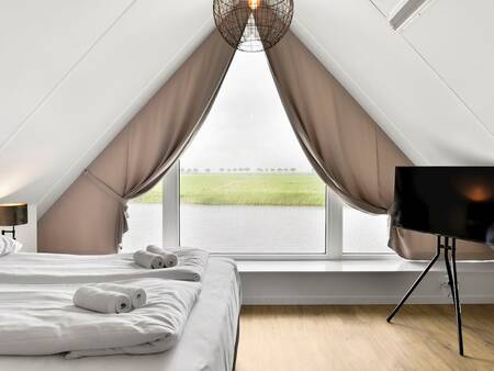 Slaapkamer van een vakantiewoning op vakantiepark Landal Waterresort Blocksyl