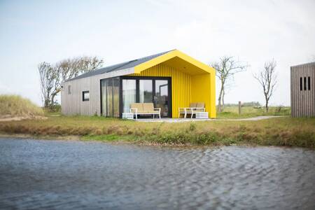 Vrijstaande vakantie lodge aan het water op vakantiepark Roompot Callantsoog